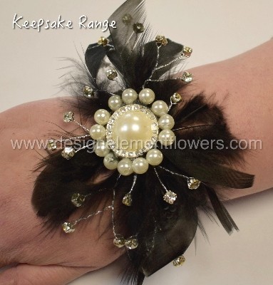 KEEPSAKE RANGE Wrist Corsage with Black Feathers , Silver Diamantes and Pearl Brooch  can be hand delivered in Manchester, Salford , Eccles , Worsley, Peel Green , Irlam , Cadishead, Salford 