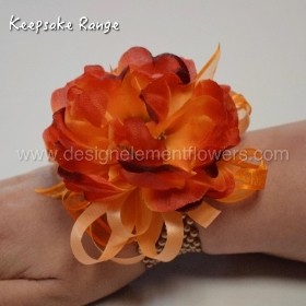 KEEPSAKE RANGE Silk Orange Peony Wrist Corsage which can be hand delivered in Manchester , Salford , Eccles , Worsley , Irlam , Cadishead , Winton , Peel Green , Urmston, Swinton 